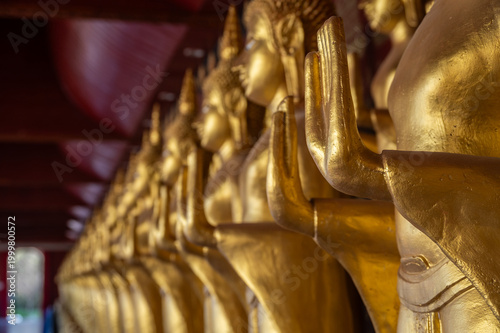 Cropped shot view of golden Buddha statues situated in Wat Sri Donsak, Bokeo province of Laos.