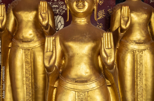 Cropped shot view of golden Buddha statues situated in Wat Sri Donsak, Bokeo province of Laos.