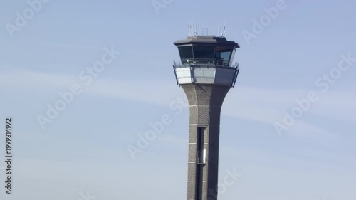Air traffic control tower against blue sky