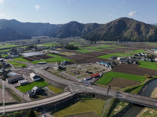 Aerial view of countryside with hills, fields, and bridges