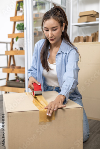 Ecommerce, packing, shipping, fulfillment, small business owner carefully placing ceramic bowl into cardboard parcel box, preparing product for safe shipment while managing home warehouse workflow.