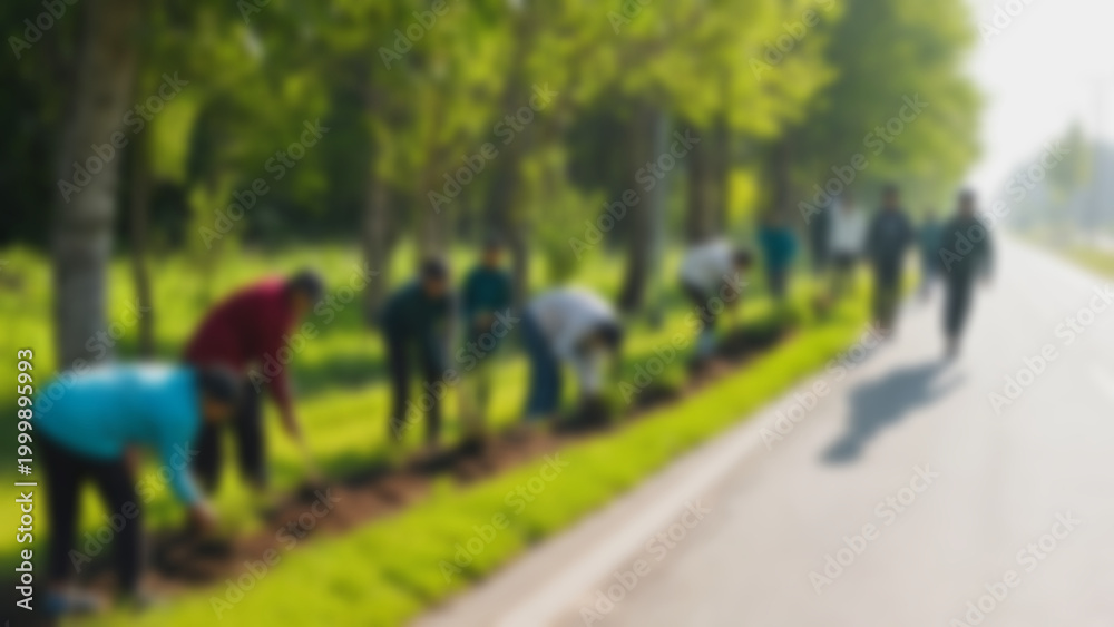 Obraz premium Group of volunteers planting along a roadside park blurred view