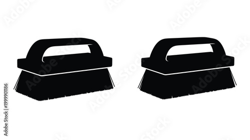 Two black scrubbing brushes depicted in a stark silhouette