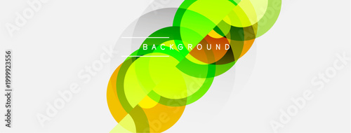 Abstract colorful shapes overlap. Bright yellow, green hues dominate white space. Modern design element for backgrounds, presentations.