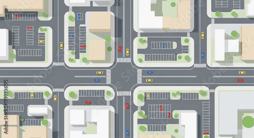 Aerial view of a city intersection with buildings and cars.
