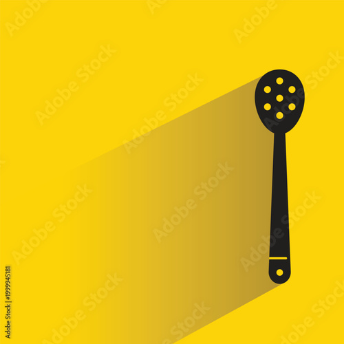 spoon icon with shadow on yellow background