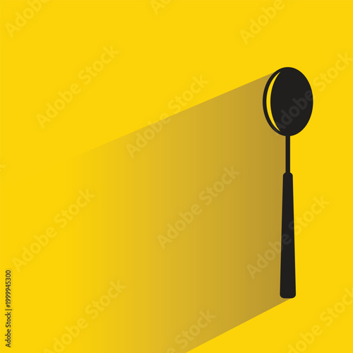 spoon icon with shadow on yellow background