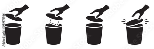 Human hand opening trash can lid to discard rectangular object into waste bin for proper sanitation.