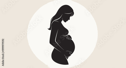 Silhouette of a pregnant woman cradling her belly, symbolizing motherhood, life, and the journey of pregnancy