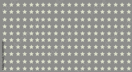 Regular pattern of many small light yellow stars arranged in neat rows on a solid gray background for a simple decorative texture design.