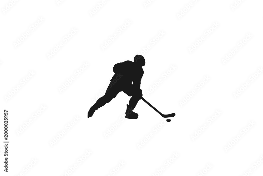 Fototapeta premium Ice hockey player silhouette in action with stick and puck