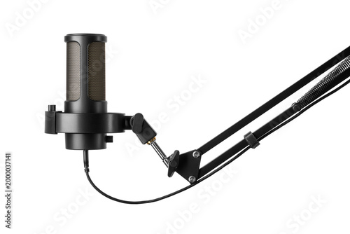 Black condenser microphone with shock mount attached to a boom arm isolated. Transparent PNG image.