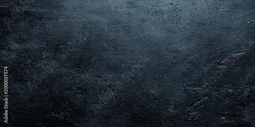 Dark gray wall slate stone texture background with rough surface and scratches for design and decoration