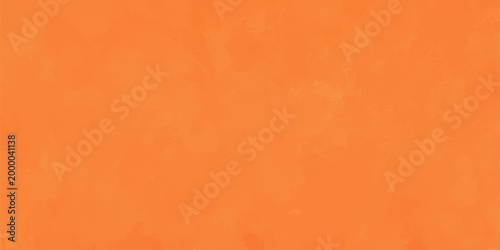 An abstract textured background of solid orange. This image offers a vibrant and versatile backdrop for various design projects.