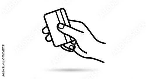 Hand holding a credit card for payment or transaction.