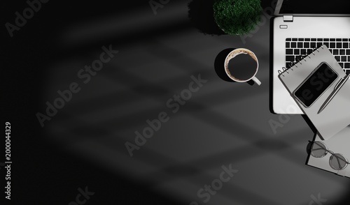 Modern Workspace with Laptop, Coffee, and Smartphone on Dark Desk with Shadows