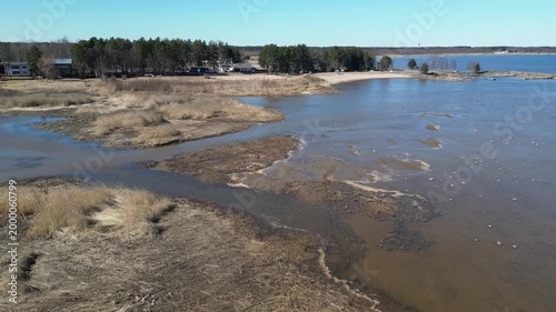 Sunny sea shore in springtime Kempeleenlahti bay, Kempele Finland