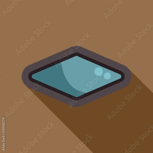 Diamond shape window with blue glass creating a long shadow on brown background