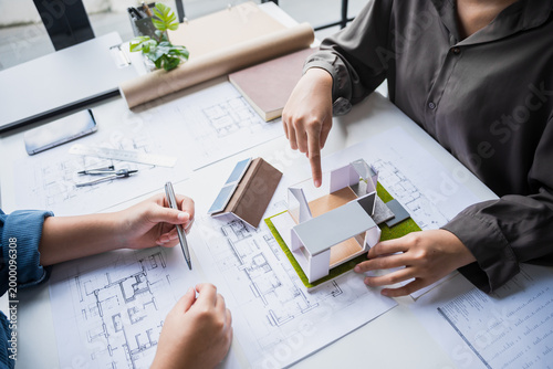 Fotografie Engineer planning for Solar panels green energy Business man working Innovation  green eco friendly in modern office business  Planing Bio economy for business renewable energy eco friendly