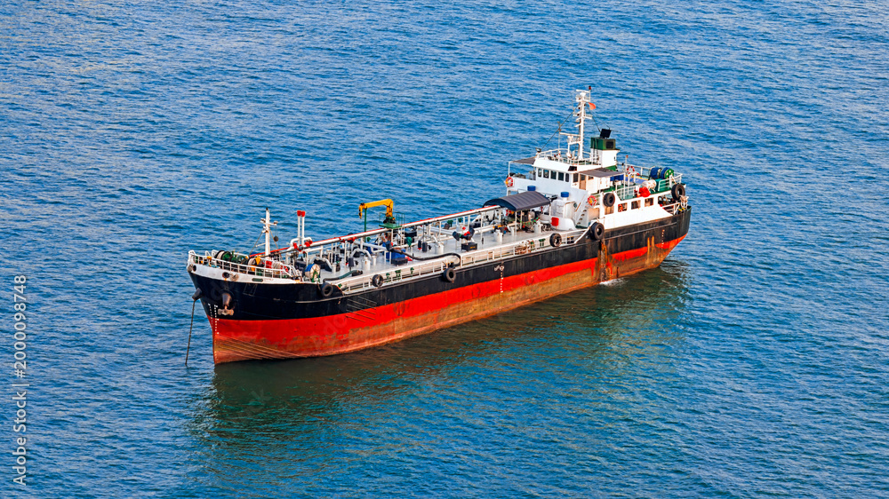 Fototapeta premium Aerial view commercial ships at sea.
