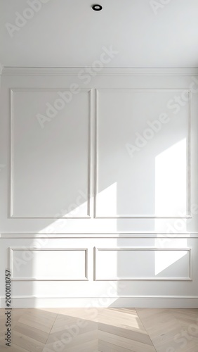A bright room with white walls and wooden floor