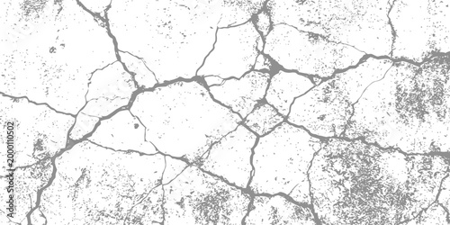 Heavy distressed grey surface texture with deep cracks and weathered particles isolated on white background for industrial or aged grunge design overlays