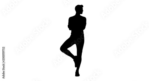 Silhouette person balancing on one leg with arms crossed
