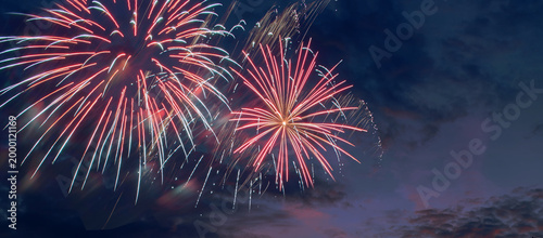 Festive fireworks background, night fireworks with colors of American flag, suitable for 4th of July USA Independence day, free space for text