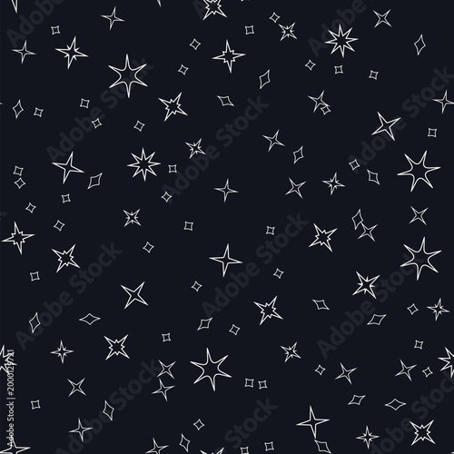 Seamless pattern of white stars scattered across a dark background, starry sky vector