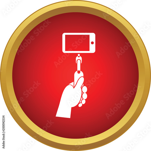 Hand holding a smartphone attached to a monopod, creating the popular selfie icon