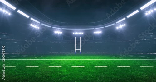 Rugby field at a sports stadium in foggy weather with shining floodlights and fans ready for an upcoming nighttime sports event. Loopable professional sports advertisement video background.