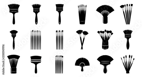 Collection of various black paintbrushes and brushes on white background for art and design