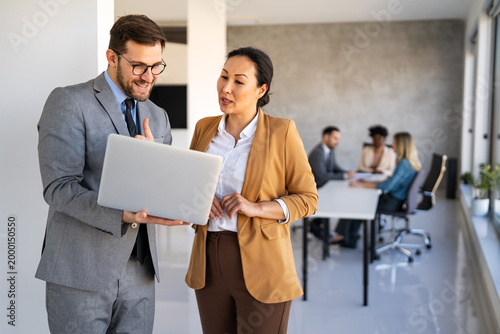 Portrait of successful multicultural business team working in corporate business office