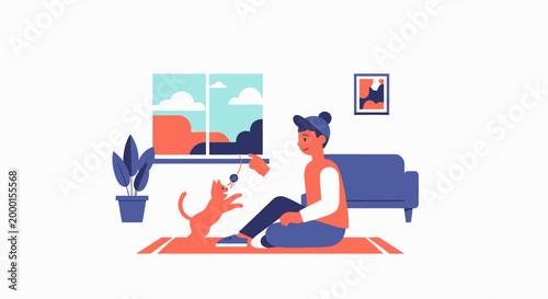 A young person plays with a playful cat indoors on a mat with a sofa and a window showing a scenic view