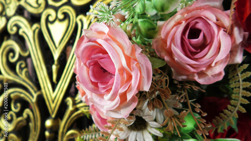 Closeup of artificial flowers decorated on the stage of a ceremonial function
