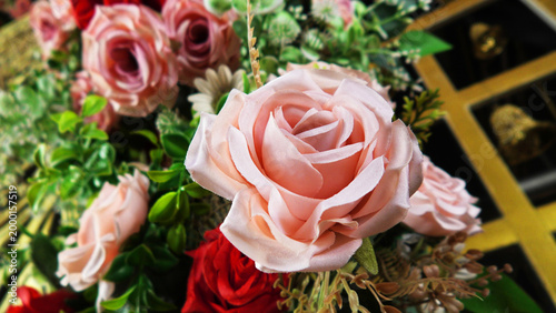 Closeup of artificial flowers decorated on the stage of a ceremonial function