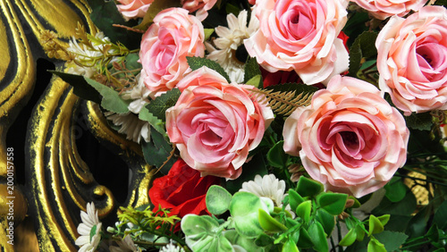 Closeup of artificial flowers decorated on the stage of a ceremonial function