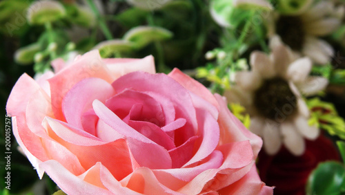 Closeup of artificial flowers decorated on the stage of a ceremonial function