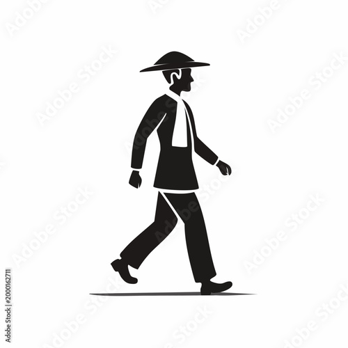 Silhouette of a person walking with a conical hat