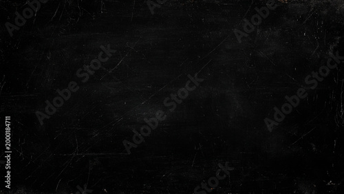 Scratched and worn black surface with scratches and marks all over