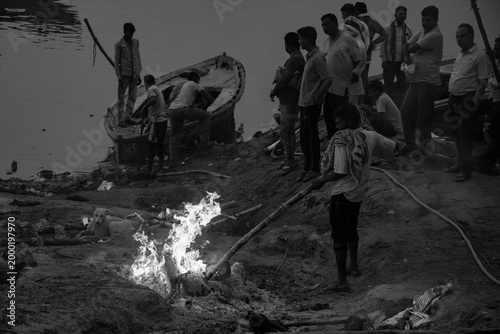 Hindu cremation ritual at Manikarnika Ghat with funeral pyre burning in Varanasi