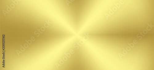 Brushed gold metal background with concentric circular brushed texture and light reflection