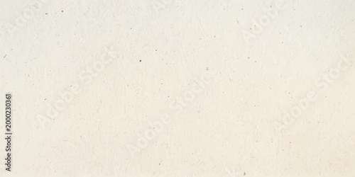 A blank vintage aged paper texture with a rough beige grunge surface and old brown cardboard pattern design provides a weathered material backdrop for art