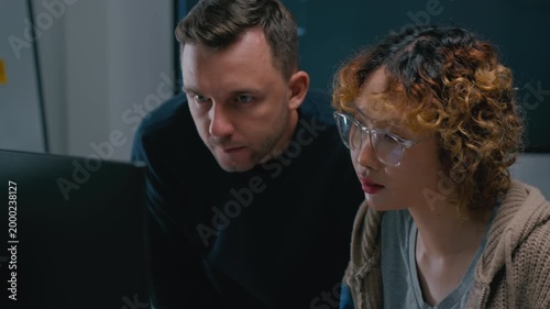 Adult male,asian female freelance typing write prompt AI bot IT app smart program,develop agentic ai,terminal with coding language,ux ui interface,designer,big data server center,quantum computer.