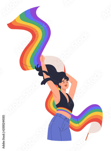 Happy lesbian woman with flowing rainbow-colored LGBTQ flag. Girl celebrating...