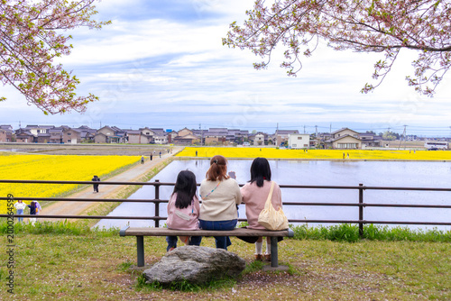 Three Women Sitting on a Bench Admiring Nature