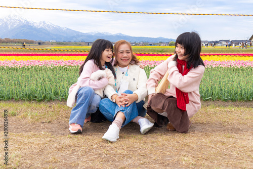 Family Enjoying Tulip Field in Bloom