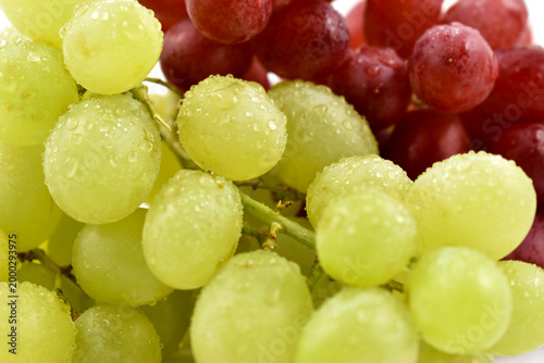 Photos Dewy fresh red and green grapes close-up stock photo images