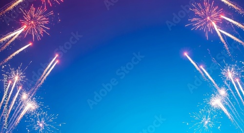 Vibrant fireworks exploding in the night sky with a gradient blue background festive celebration scene