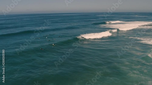 View from a drone of a surfer surfing a wave 